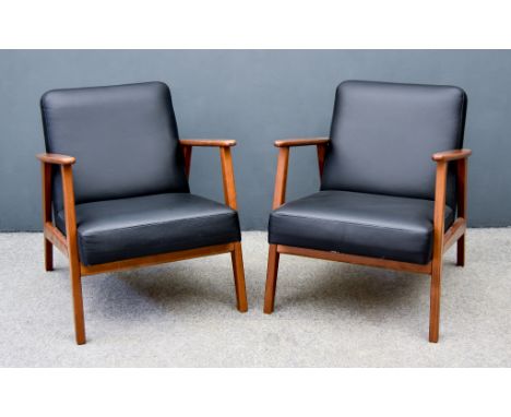 A Pair of "Ekenaset" Hardwood Framed Easy Chairs, by Ikea, the back and seats upholstered in black leather, on square support
