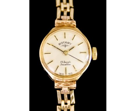 A Lady's Manual Wind Wristwatch, by Rotary, 9ct gold case, 18mm diameter, silver dial with gold baton numerals, 170mm overall