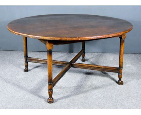 A 20th Century Oak Circular Breakfast Table, on four turned legs with X-pattern stretcher, 60ins diameter x 29.5ins highTo th