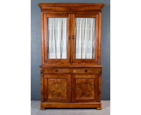 A 19th Century French Provincial Fruitwood Bookcase, the upper part with moulded cornice, fitted two shelves enclosed by pair