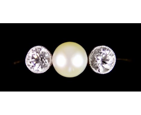 An 18ct Gold Diamond and Pearl Ring, set with a centre cultured pearl, 10mm diameter, flanked by two brilliant cut white diam