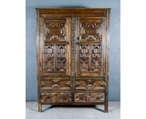 A&nbsp;17th Century&nbsp;Oak Cupboard, with moulded edge to top, enclosed by a pair of doors with geometric moulded fronts, f