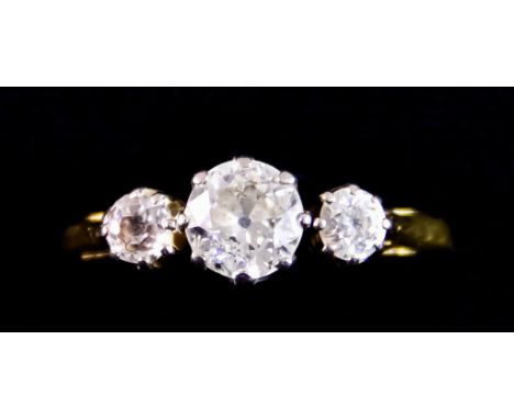 A Three Stone Diamond Ring, set with a centre brilliant cut white diamond, approximately .50ct, flanked by two small brillian