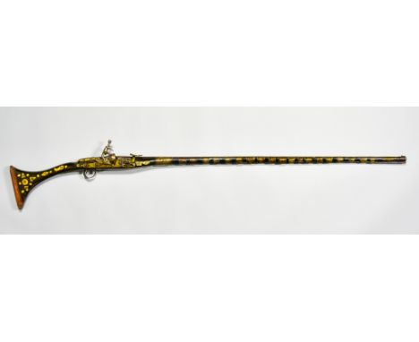 A Tribesman's Decorative Musket, 43ins barrel, flintlock action, wood stock and fore end decorated with other inlaid woods an