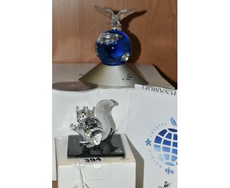 TWO BOXED SWAROVSKI CRYSTAL SCULPTURES, comprising a Crystal Planet designed to celebrate the year 2000, depicting a blue and