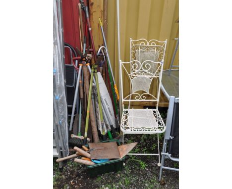 A PAIR OF ORNATE MODERN METAL FOLDING GARDEN CHAIRS and a selection of garden tools including shears, spades, forks, etc