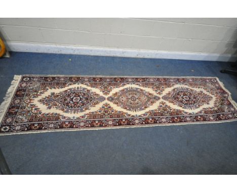 A WOOLLEN CARPET RUNNER, length 306cm x 81cm (condition report: very low pile patches to mainly one area, see images, dirty)