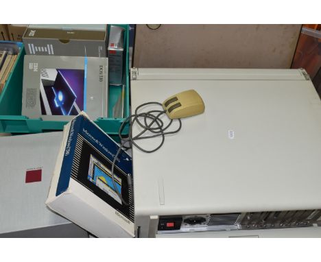 AN IBM PORTABLE PERSONAL COMPUTER 5155, model 68, an early portable computer, released in 1984, with instruction booklet, mou