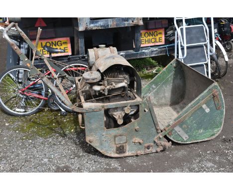 A LARGE DENNIS PETROL CYLINDER LAWN MOWER, with grass box and starting handle (engine moves freely but not started, rusty all