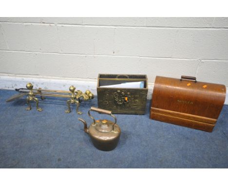 A BRASS THREE FIRE IRON SET, with ball and claw detail, to include a tong, shovel, poker, on a pair of fire dogs, along with 