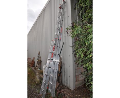 A SET OF ALUMINIUM DOUBLE EXTENSION LADDERS with fourteen rungs to each 390cm length and another double extension ladder with