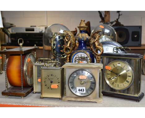 A GROUP OF TEN MANTEL CLOCKS, comprising a mid- century USSR Vesna mantel clock, an oak cased clock, two glass domed annivers