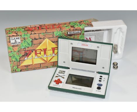 ZELDA NINTENDO GAME &amp; WATCH BOXED, includes the system and instruction manual, requires new batteries (1)