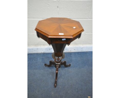 A VICTORIAN WALNUT OCTAGONAL TRUMPET SEWING TABLE, with a fitted interior, on tripod legs, diameter 42cm x height 71cm (condi