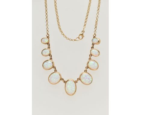 A 9CT GOLD, SYNTHETIC OPAL NECKLACE, designed as a graduated series of oval synthetic opal cabochons, each collet set, fitted