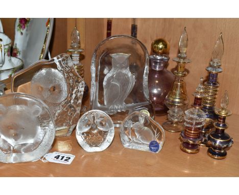 A COLLECTION OF GLASS SCULPTURES AND SCENT BOTTLES, comprising three Mats Jonasson relief glass sculptures: a bear cub, an ow