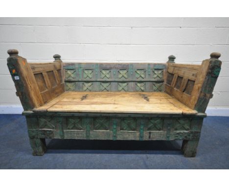 AN ANTIQUE AND LATER EASTERN HARDWOOD SETTLE / SOFA, the uprights with turned finials at each corner, decorative ironwork, fr