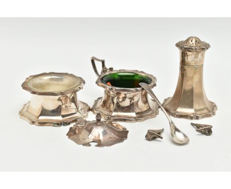 A THREE PIECE SILVER CONDIMENT SET, comprising of a mustard with green glass insert and broken cover, a salt with a clear gla