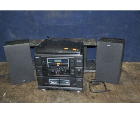 A SANYO DC-X120 MIDI HI FI with two matching speakers and speaker stands (PAT pass and working) (Condition: lid clips broken)