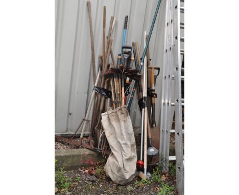 A SELECTION OF GARDEN TOOLS including a set of hickory and brass chimney brushes, rakes, forks, spades, shovels, shears etc