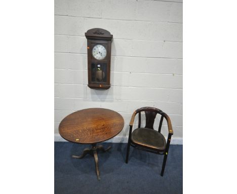 A GEORGIAN OAK CIRCULAR TRIPOD TABLE, diameter 81cm x height 69cm, a stained wood armchair, and an oak wall clock (condition 