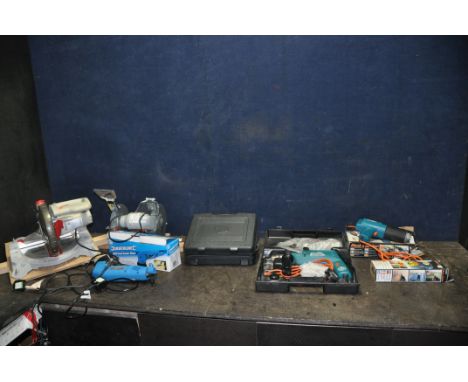 A COLLECTION OF POWER TOOLS including a Performance NLE210MS Compound Mitre Saw, a Performance NLH150BG bench Grinder, a Silv