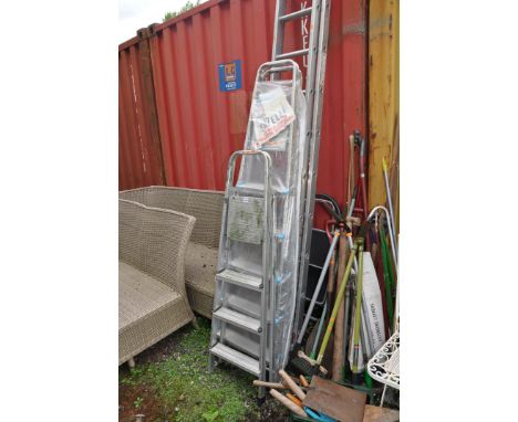 A SET OF ALUMINIUM DOUBLE EXTENSION LADDERS with thirteen rungs to each 350cm section along with three aluminium and one stee