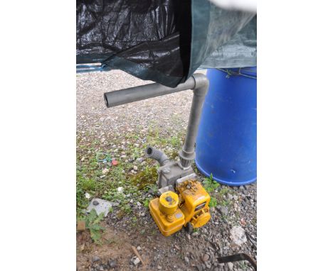 A LEE HOWL PETROL WATER PUMP with a Briggs and Stratton engine (pulls freely but hasn't started) and pipe