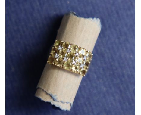 A 9ct gold ring set with citrines and diamonds to a 9ct yellow gold setting and shank, marked QVC, size T 1/2, approximately 