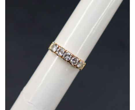 A five stone diamond ring set with round brilliant cut diamonds each approximately 0.10cts each to a yellow metal setting and