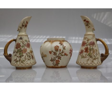 A pair of Royal Worcester porcelain ewers decorated with flowers and leaves number 1361 together with an octagonal lobed ging