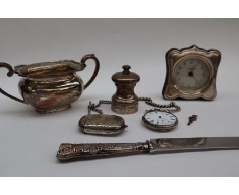 An Edward VII silver twin handled sugar basin, Birmingham, 1908, together with a silver handled bread knife, silver pepperett