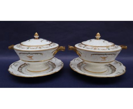 A pair of Swansea porcelain sauce tureens, covers and stands, with moulded lids and borders, delicately decorated and gilded,