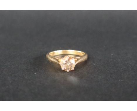 An 18ct yellow gold solitaire diamond ring set with a champagne coloured round brilliant diamond approximately 1.13cts, size 
