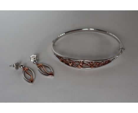 A Clogau silver tree of life hinged bangle with gold detailing, together with a pair of similar drop earrings, a Clogau silve