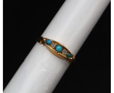A yellow metal ring set with turquoise and diamonds to a yellow metal setting, approximately 1.8 grams CONDITION REPORT: Shan