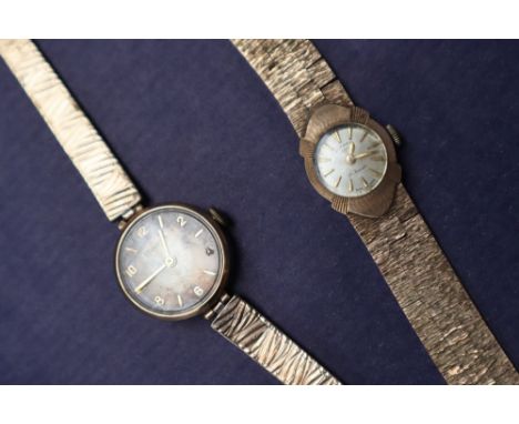 A lady's 9ct gold Rotary wristwatch, with a circular dial and batons, on an integral 9ct gold strap together with a lady's 9c
