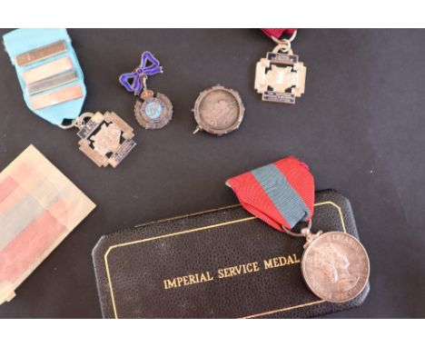 An Elizabeth II Imperial Service Medal, issued to Thomas Howell Pugh, cased together with two Long Service medals for The Nat
