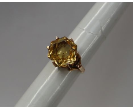 An 18ct yellow gold ring set with a single hexagon cut citrine approximately 13mm x 13mm x 9.5mm deep to an 18ct yellow gold 