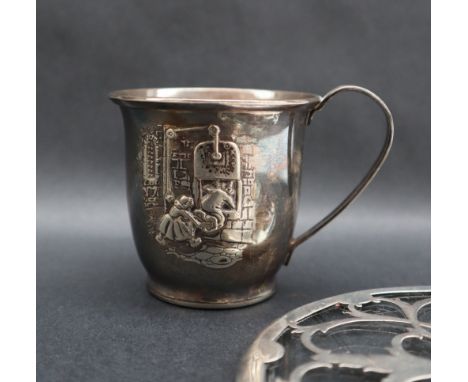A continental white metal christening mug with embossed decoration, marked 90, approximately 80 grams together with a silver 