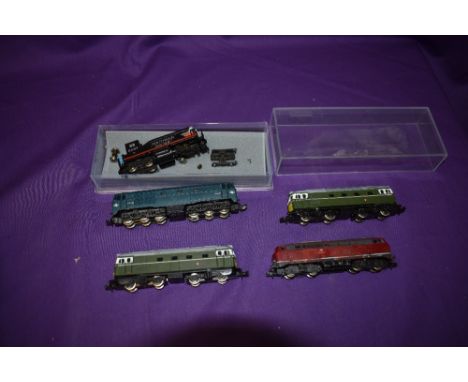 Four Lima, Fleischmann Piccolo and Trix N gauge Diesel Locomotives and a similar Southern pacific N gauge Locomotive (af)