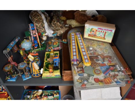 A shelf of mixed vintage Tin Plate Toys including Fairground Rides (China) Trains (germany), a State Fair Bagatelle and a sim