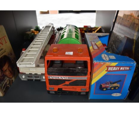 A Tonka Toys pressed steel Fire Engine, a Bruder plastic Recycling Wagon and a Remco pressed steel Big Rig Towing Truck with 