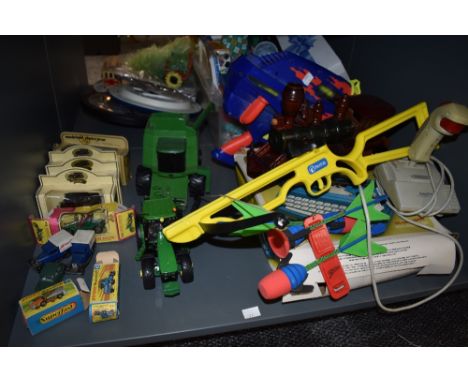 A shelf of mixed toys including two Matchbox Superfast diecasts no7 Refuse Truck and no48 Dodge Dumper Truck, both boxed, eig