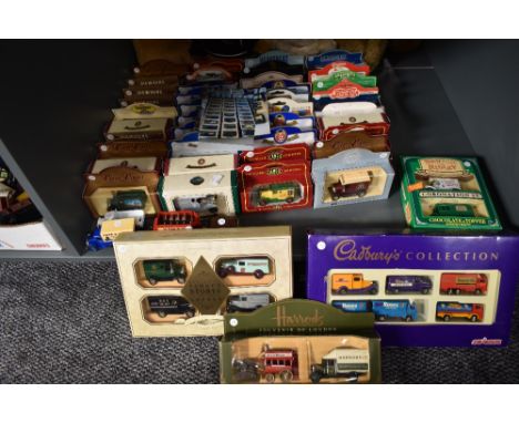 A shelf of approx Fifty modern diecasts including Majorette Cabrury Collection boxed set, Harrods, Cameo, Oxford and similar,