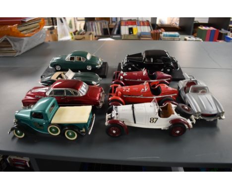 A collection of 1:18 scale diecasts, Solido Ford V8, Burago Mercedes 300SL, Jaguar E 1961,Mercedes Benz 33K and Alfa Romeo 23