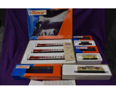 A RoCo HO scale Toshiba Three Piece Carriage set having Control Car, boxed 44020, a RoCo HO scale DB Locomotive, boxed 43413 