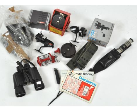 A box of assorted fishing and sporting equipment, including fishing reels, knives, trenching tools and binoculars