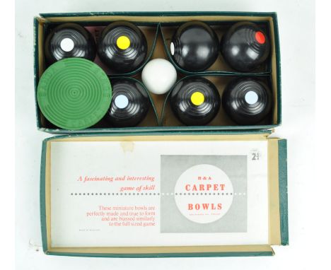 A boxed set of Banda Brand Composite carpet bowls, 2 Bias, 7cm high x 29cm wide x 14cm deep