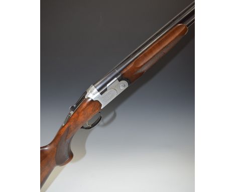 Beretta 686 Special 12 bore over and under ejector shotgun with with all over floral engraving, chequered semi-pistol grip an